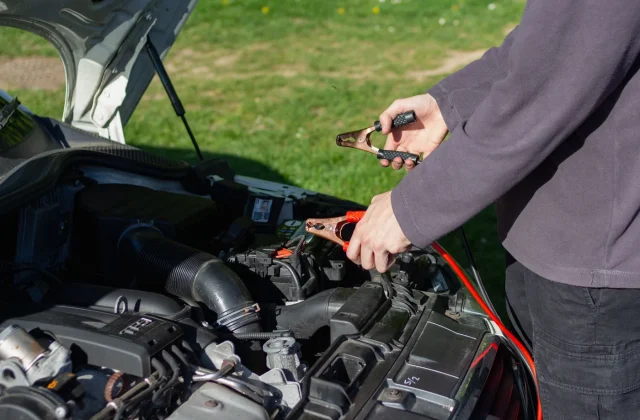 technician-jump-starting-vehicle